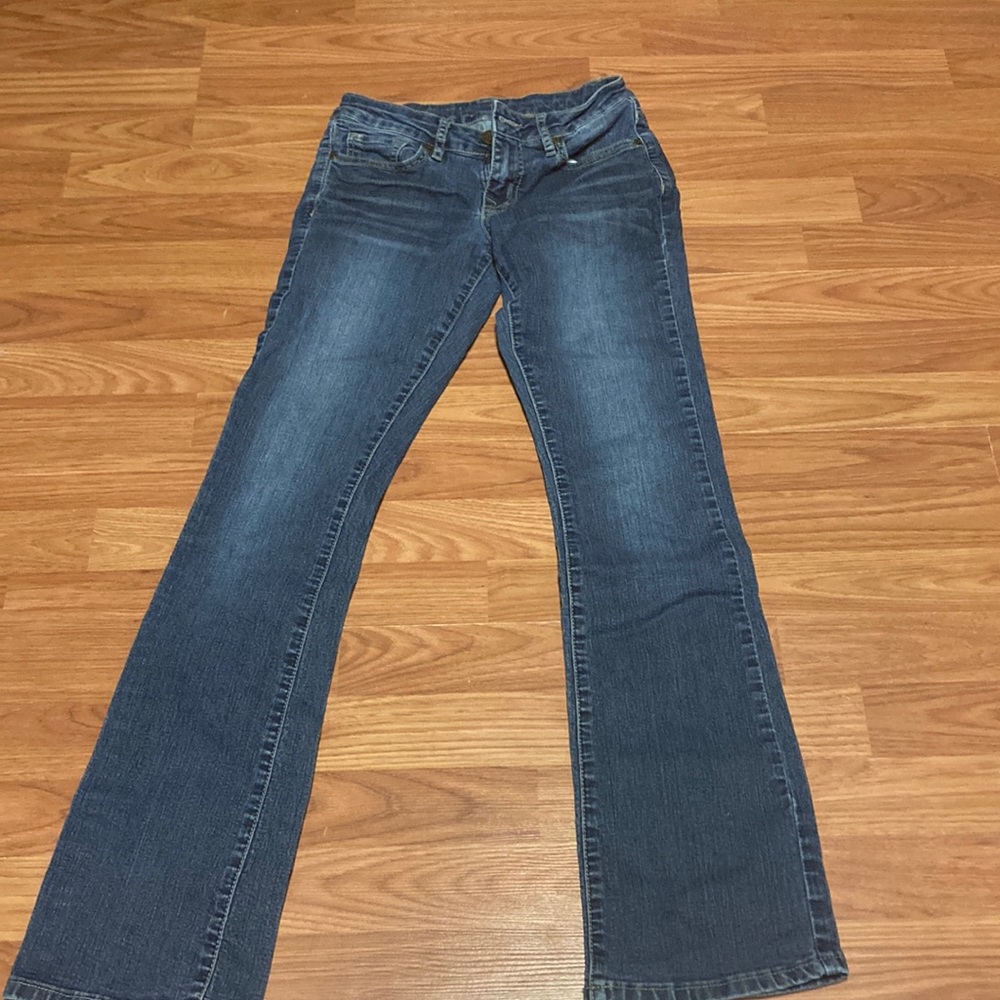 Dark wash denim low waist jeans. Used in good condition.